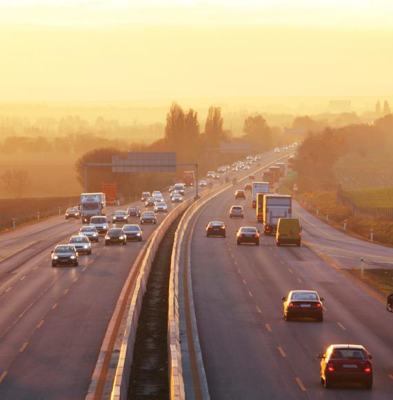 Traffic on highway with cars.