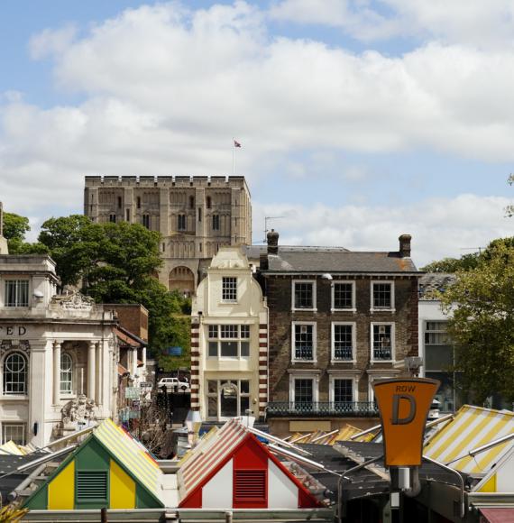 The famous market in the centre of Norwich, with Norwich Castle behind.