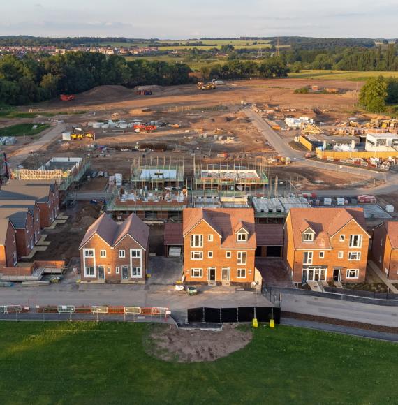 Aerial view looking down on new build housing construction site in England, UK