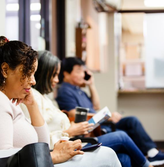 People sit in doctor's waiting room