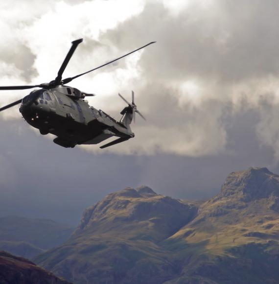 RAF Merlin helicopter hugs valleys in the lake district mountains
