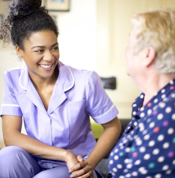 care worker on a house call with an elderly lady