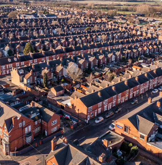 Aerial view of the rooftops of a block of back to back terraced houses in the North of England