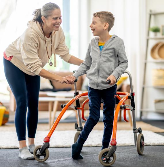 Disabled child with his mother at home