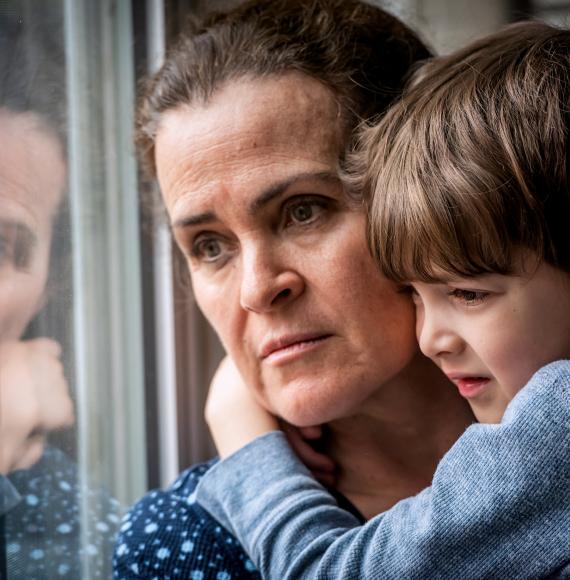 Pensive Mature woman posing with her son