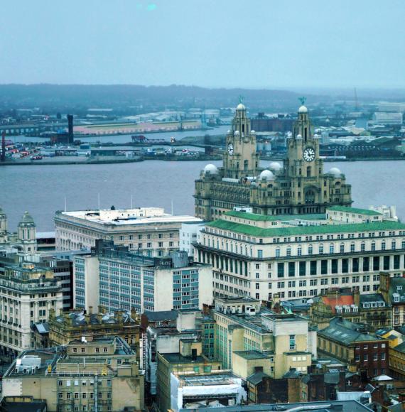 view of Liverpool and the Royal Liver Building on the river Mersey England.