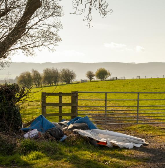 Illegal Fly Tipping by a Farmers Gate on a Quiet Rural Lane