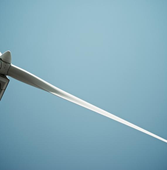 Wind turbine with the blue sky in the background