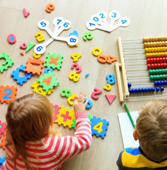 Two small children learning together 