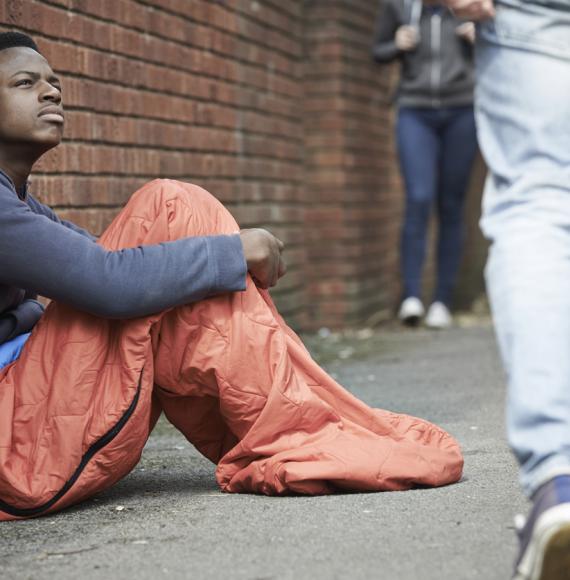 Homeless teenager sleeping on the street