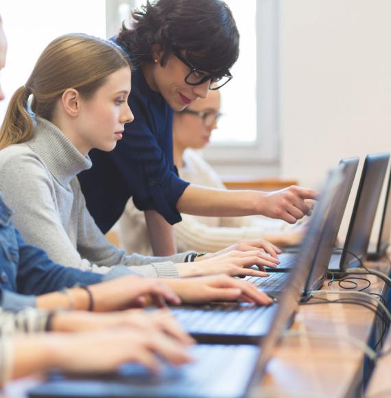 Young female student learning digital skills