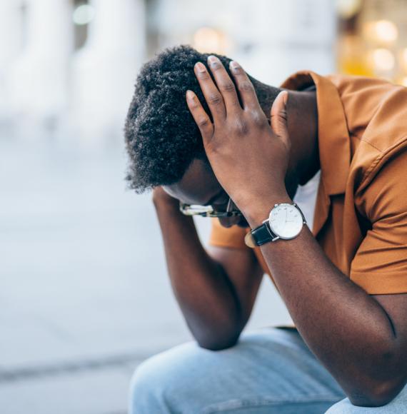 Young man contemplating suicide