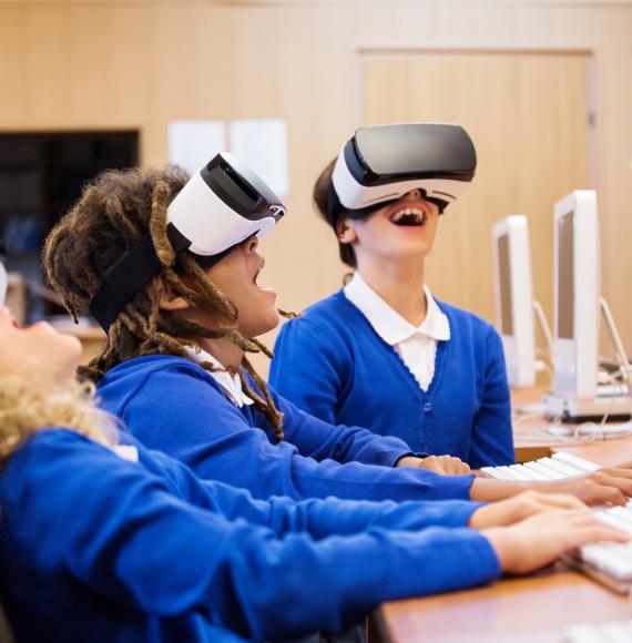 group of students using virtual reality goggles
