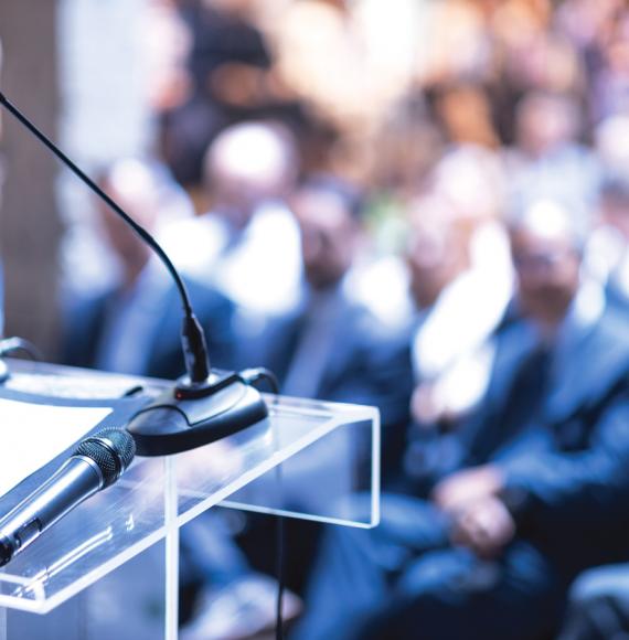 Person speaking at an awards ceremony