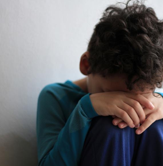 An upset child in poverty