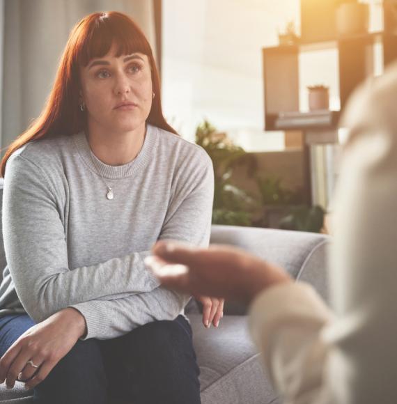 A woman talking to a psychologist