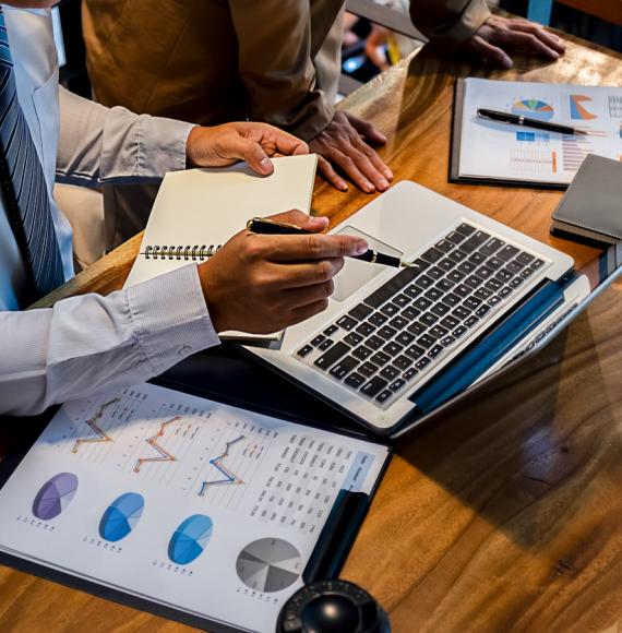 Businessman inspects financial reports