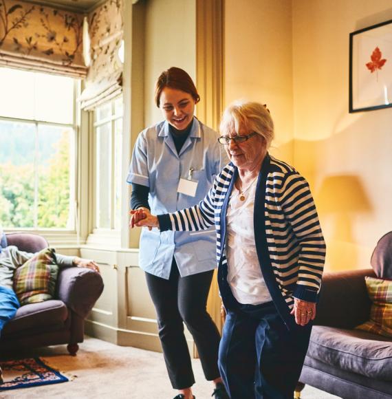 Nurse supporting woman with care needs