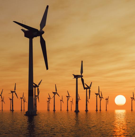 Offshore wind turbines at sunset
