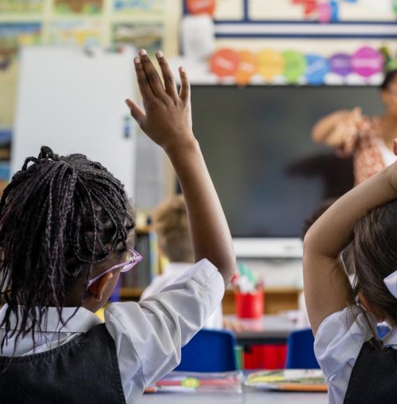 Primary school students sitting in a classroom