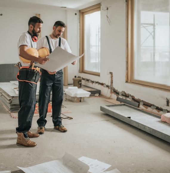 Two builders working on a new house