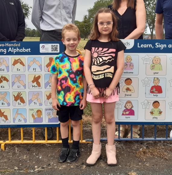 Kids with sign language signs 