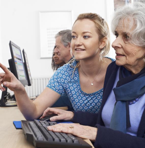 Person being helped to use a computer