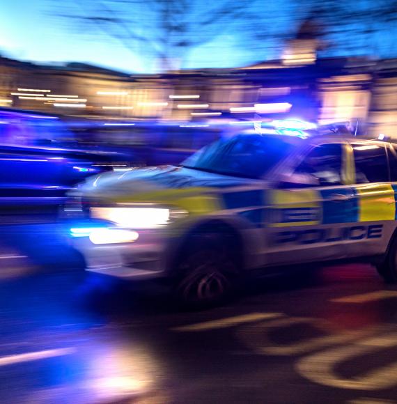 Police car responding to crime in London