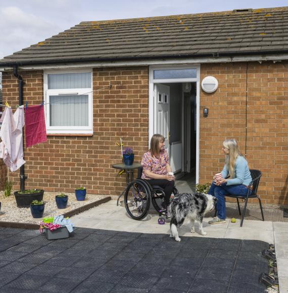 Two women catching up at supported housing
