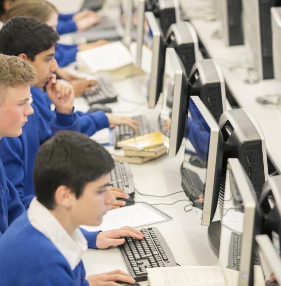 Teenage students using computers