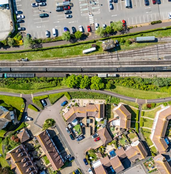 View of houses next to a train station