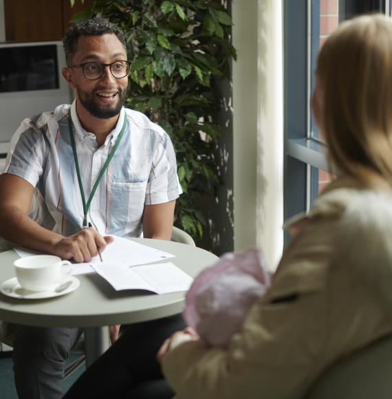 Young woman with social worker