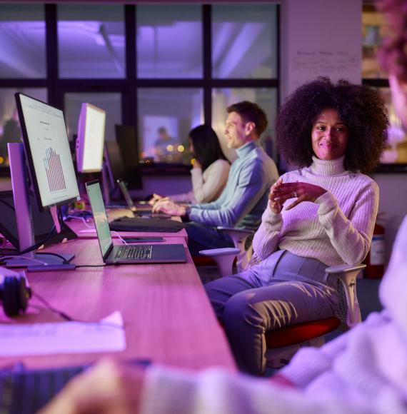 Creative woman talking with colleagues