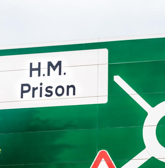 HM Prison road sign