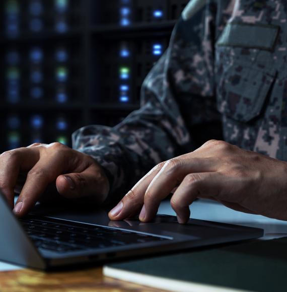Soldier working on computer