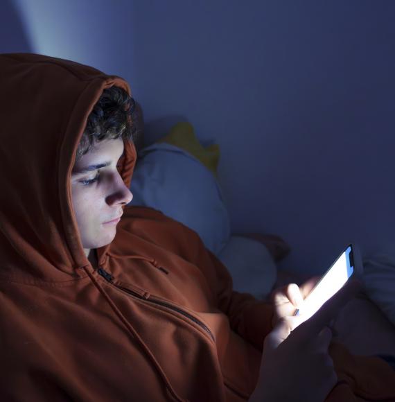 Teenager using a smartphone