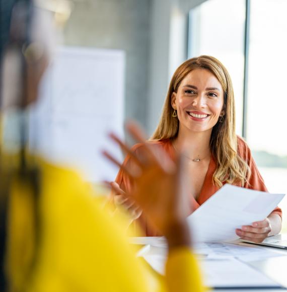 Two people talking at work