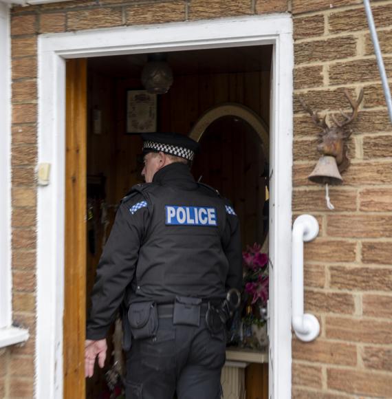 Police Officer entering someone's home