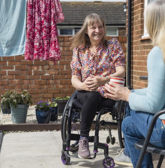 Woman in a wheelchair at home