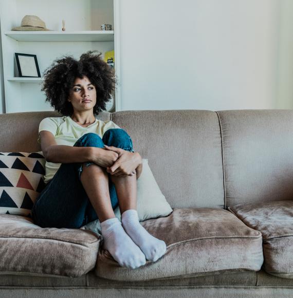 Young person sat at home