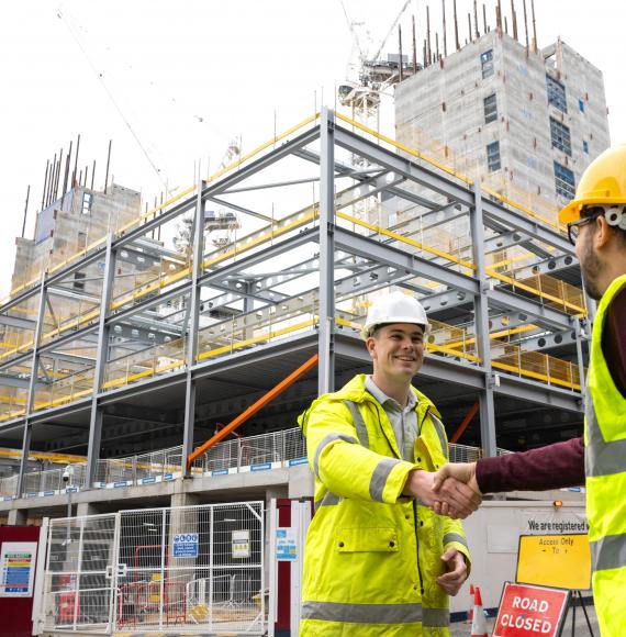 Men shaking hands at work
