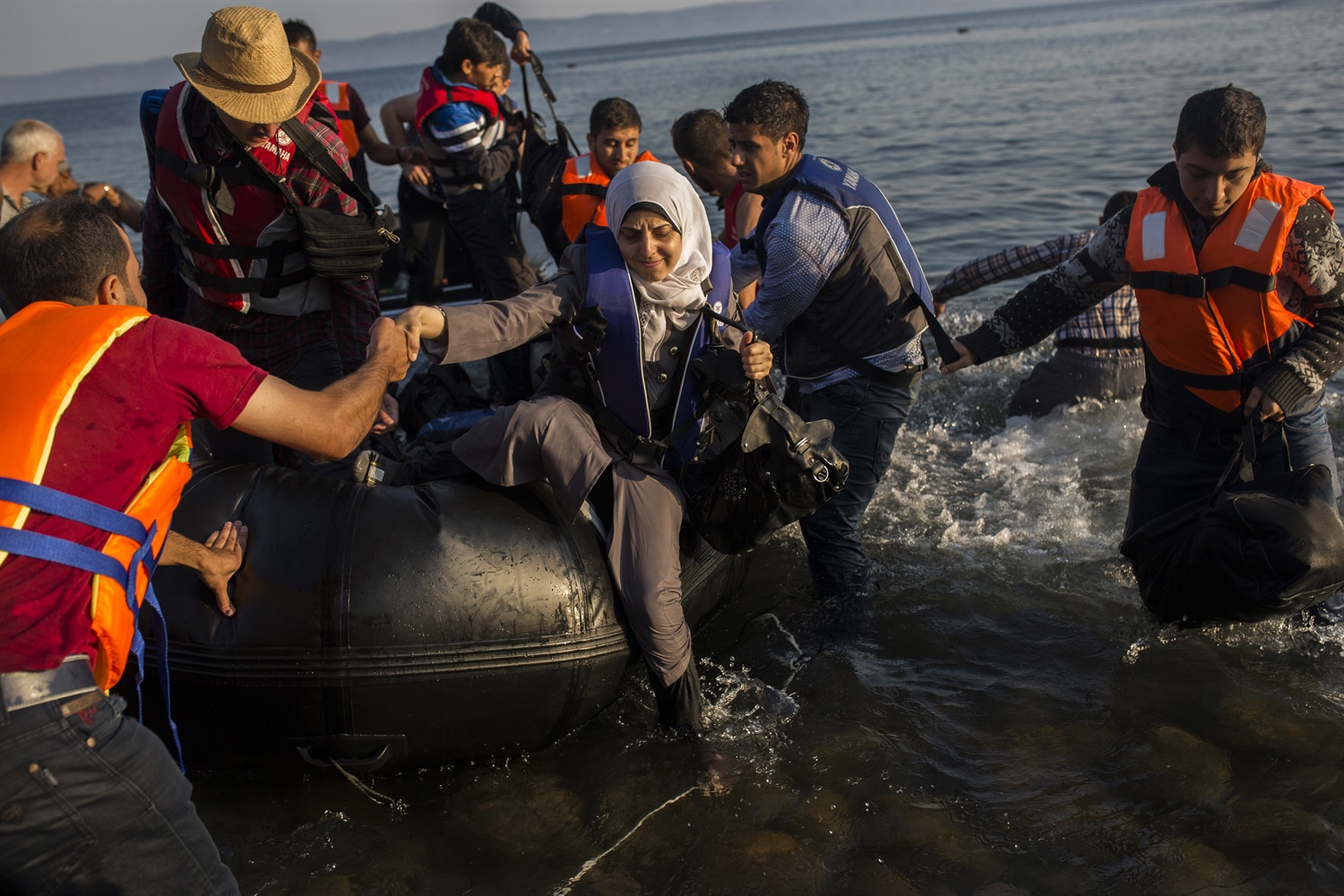 Migrants from Syria, Afghanistan arrive on Lesbos. July 15. AP Photo, Santi Palacios