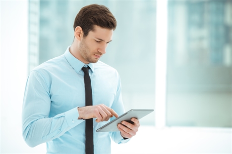 Business man with ipad tablet